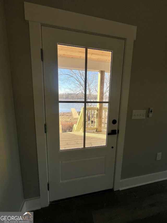 entryway featuring a water view