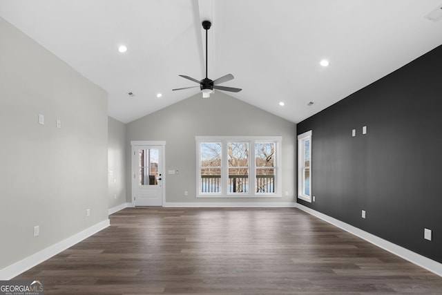 unfurnished living room featuring high vaulted ceiling, ceiling fan, baseboards, and dark wood-type flooring