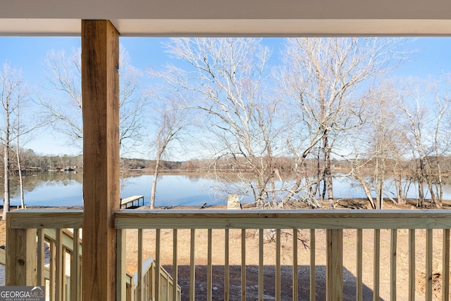 wooden deck with a water view