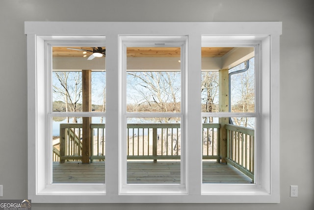 doorway with a ceiling fan and a healthy amount of sunlight