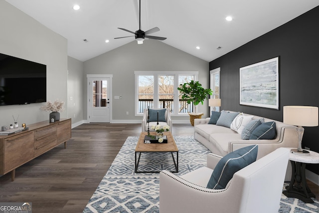 living room with baseboards, a ceiling fan, dark wood-type flooring, high vaulted ceiling, and recessed lighting