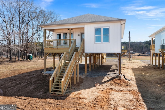 view of jungle gym featuring covered porch and stairway