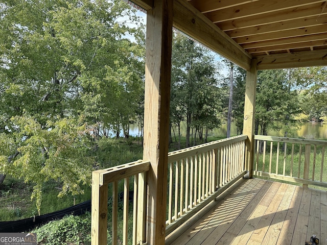 wooden deck with a water view