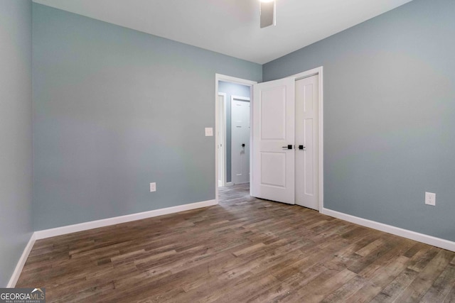 spare room with dark hardwood / wood-style flooring