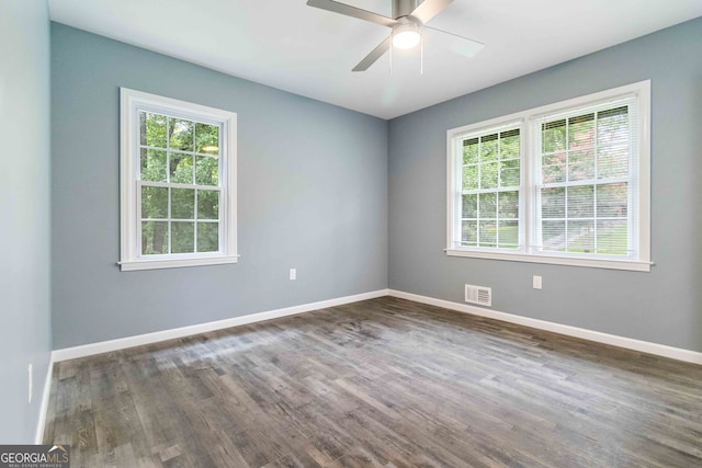 unfurnished room featuring ceiling fan and dark wood-type flooring