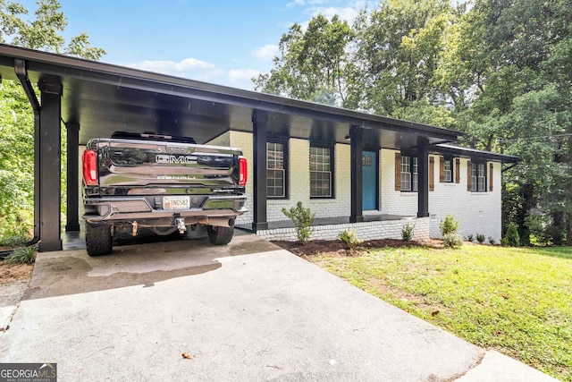 ranch-style house with a carport and a front lawn