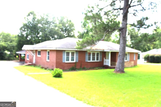 ranch-style house with a front lawn