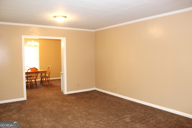 unfurnished room with crown molding, a chandelier, and dark carpet