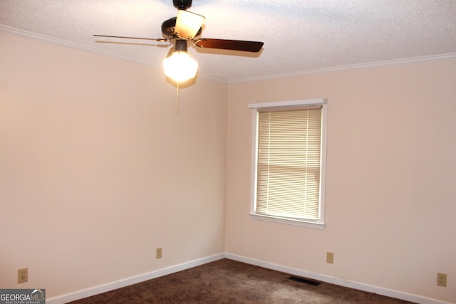 unfurnished room with ceiling fan, ornamental molding, a textured ceiling, and dark colored carpet