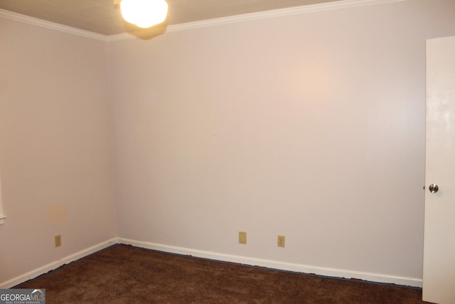 unfurnished room with dark colored carpet and ornamental molding