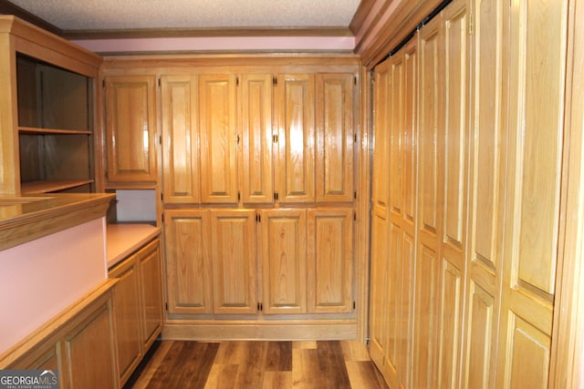 room details featuring hardwood / wood-style flooring and a textured ceiling