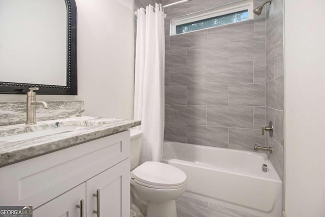 full bathroom featuring vanity, toilet, and shower / bathtub combination with curtain