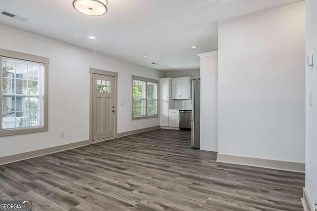 foyer entrance with dark wood-type flooring