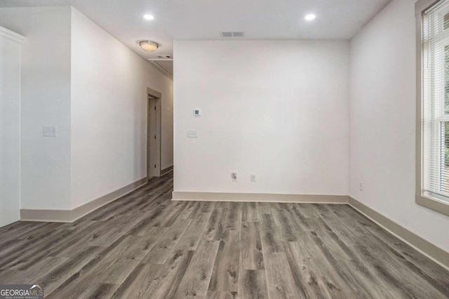 empty room featuring dark wood-type flooring