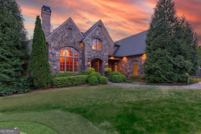 view of front of house with a yard