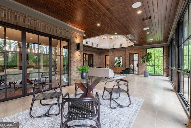 sunroom / solarium featuring wood ceiling