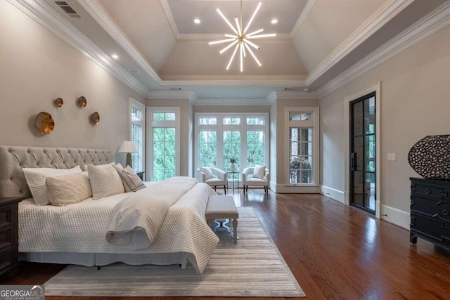 bedroom featuring dark hardwood / wood-style flooring, a raised ceiling, a notable chandelier, and crown molding