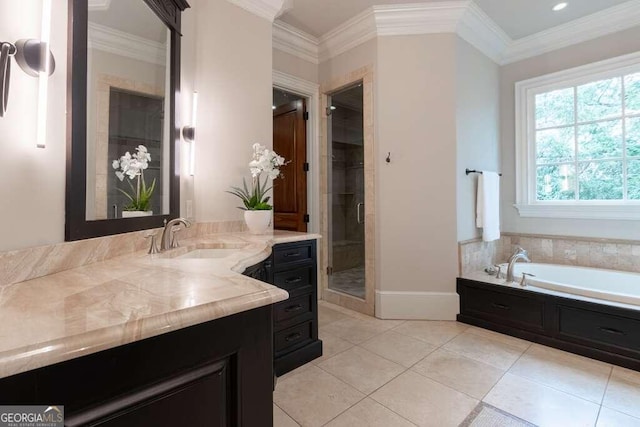 bathroom with tile patterned flooring, ornamental molding, separate shower and tub, and vanity