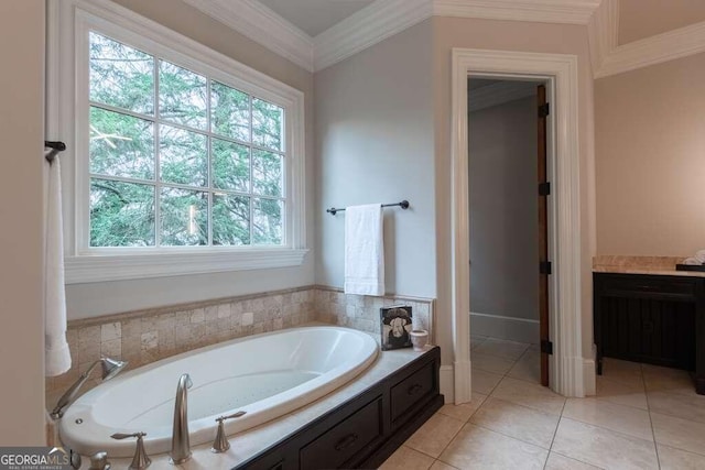 bathroom featuring vanity, tile patterned floors, ornamental molding, and a bathing tub