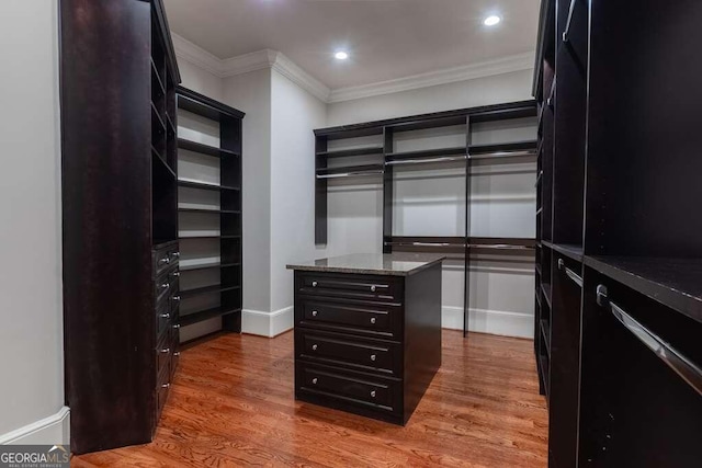 walk in closet featuring hardwood / wood-style floors