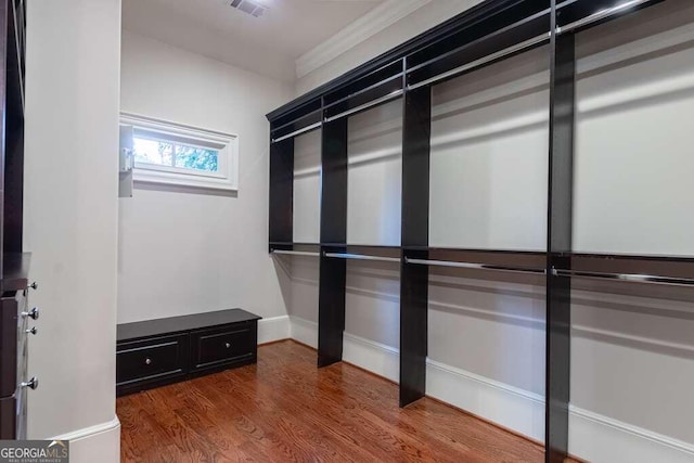 spacious closet featuring hardwood / wood-style flooring