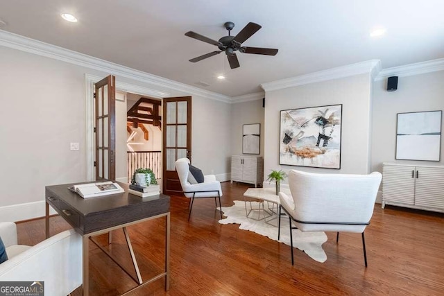 office area featuring ceiling fan, ornamental molding, and wood-type flooring