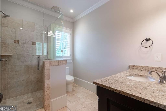 bathroom with tile patterned flooring, ornamental molding, toilet, walk in shower, and vanity