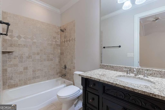 full bathroom featuring toilet, ceiling fan, tiled shower / bath, and crown molding