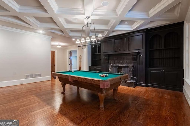 game room featuring hardwood / wood-style flooring, billiards, crown molding, a high end fireplace, and beamed ceiling