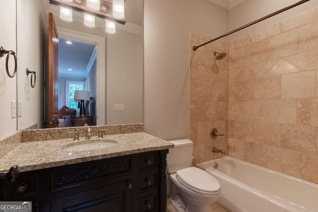 full bathroom featuring toilet, tiled shower / bath combo, crown molding, and vanity