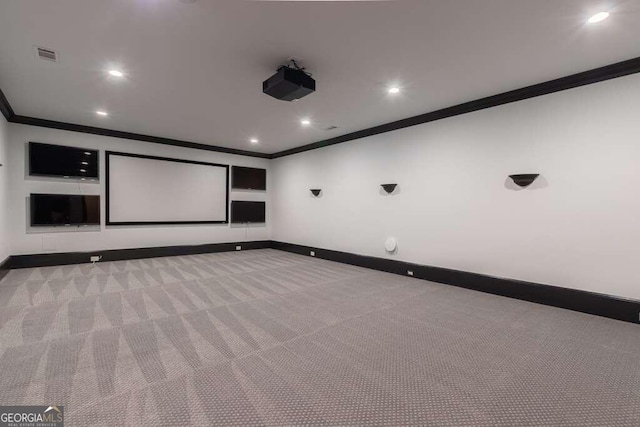 carpeted cinema featuring crown molding