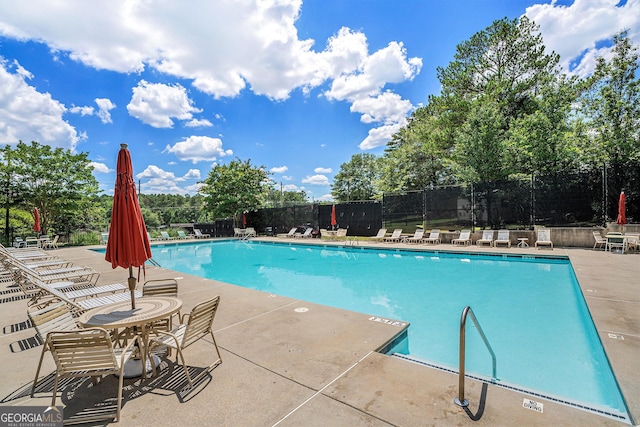 view of swimming pool featuring a patio