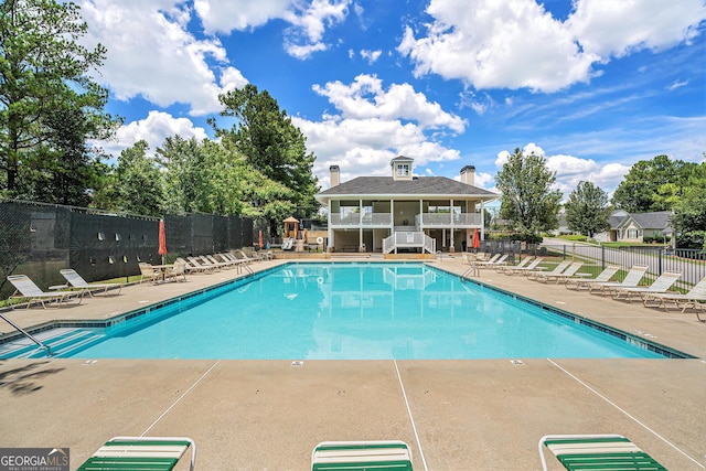 view of pool featuring a patio