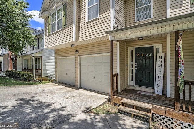 doorway to property featuring a garage