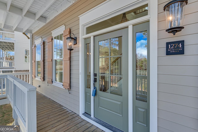 entrance to property featuring a porch