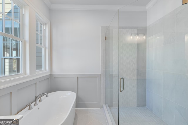 bathroom with tile patterned flooring, independent shower and bath, and crown molding