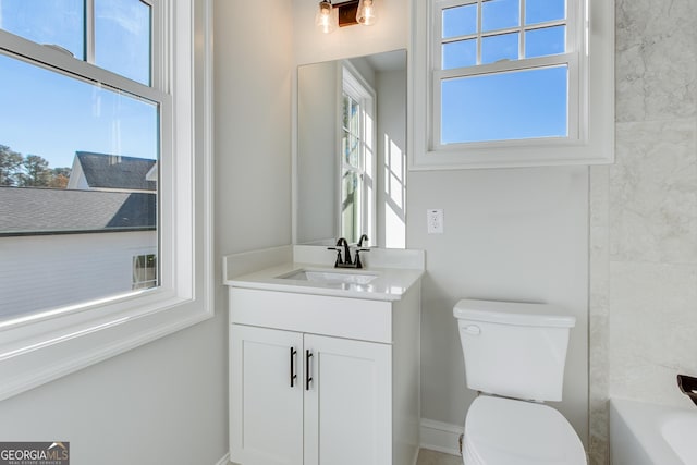 bathroom with vanity and toilet