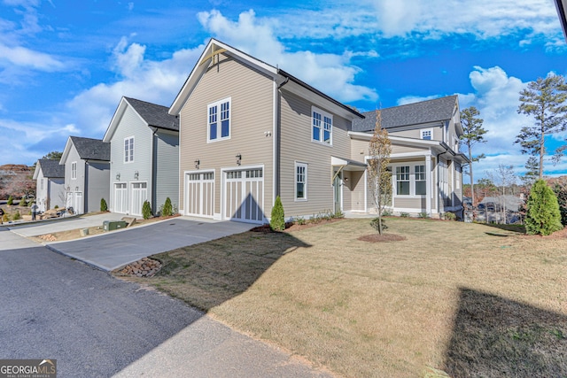 view of front facade with a front yard and a garage