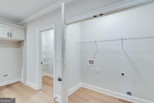 clothes washing area with hookup for an electric dryer, hookup for a washing machine, light hardwood / wood-style flooring, and ornamental molding