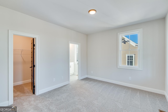 empty room with light colored carpet