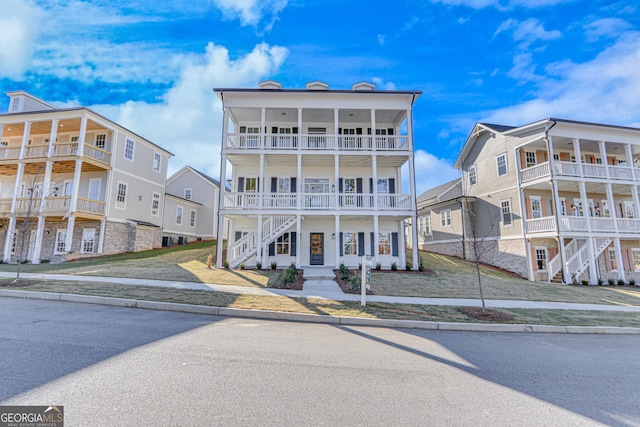 view of front of property with a balcony