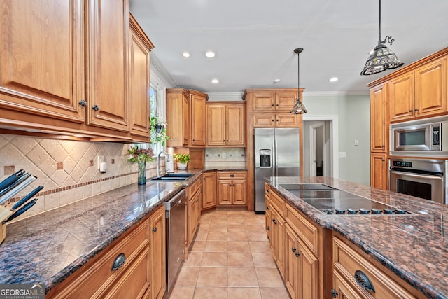 kitchen with hanging light fixtures, crown molding, sink, appliances with stainless steel finishes, and backsplash