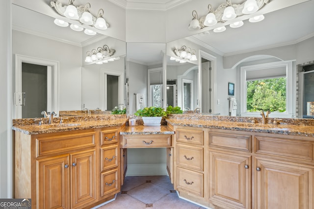 bathroom featuring tile patterned floors, crown molding, and vanity