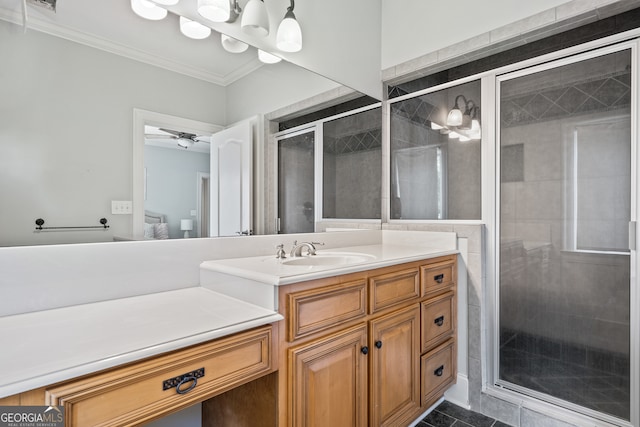 bathroom with walk in shower, crown molding, toilet, vanity, and ceiling fan