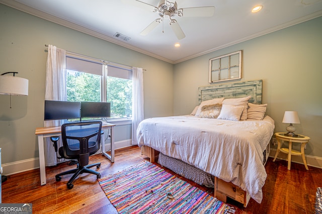 bedroom with ornamental molding, ceiling fan, and hardwood / wood-style floors