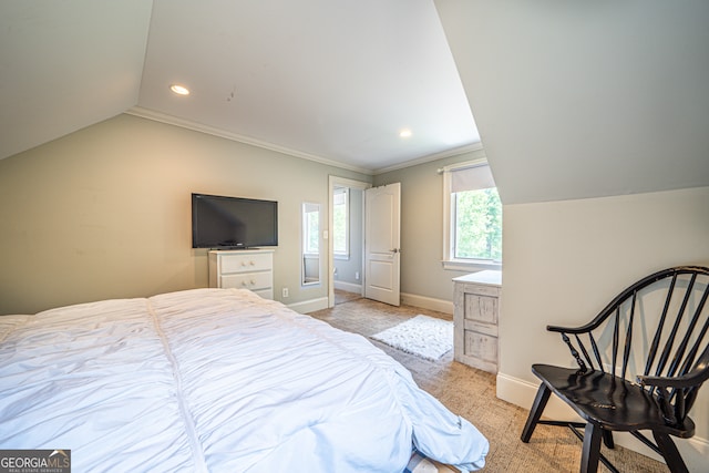 bedroom with crown molding, lofted ceiling, and light colored carpet