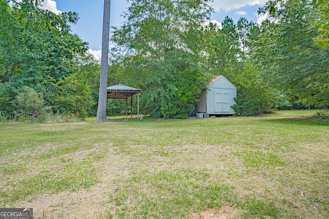 view of yard with a gazebo and a shed