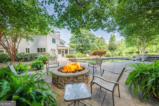 view of patio featuring a fire pit