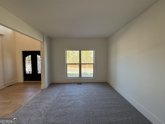 foyer featuring carpet