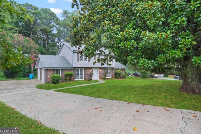 view of front facade featuring a garage and a front lawn